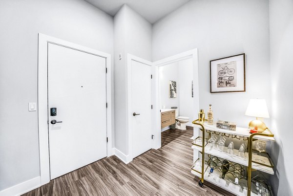 Front door entry of Beckon Collective Apartments in Greystar's luxury apartment community, showcasing elegant design and welcoming features