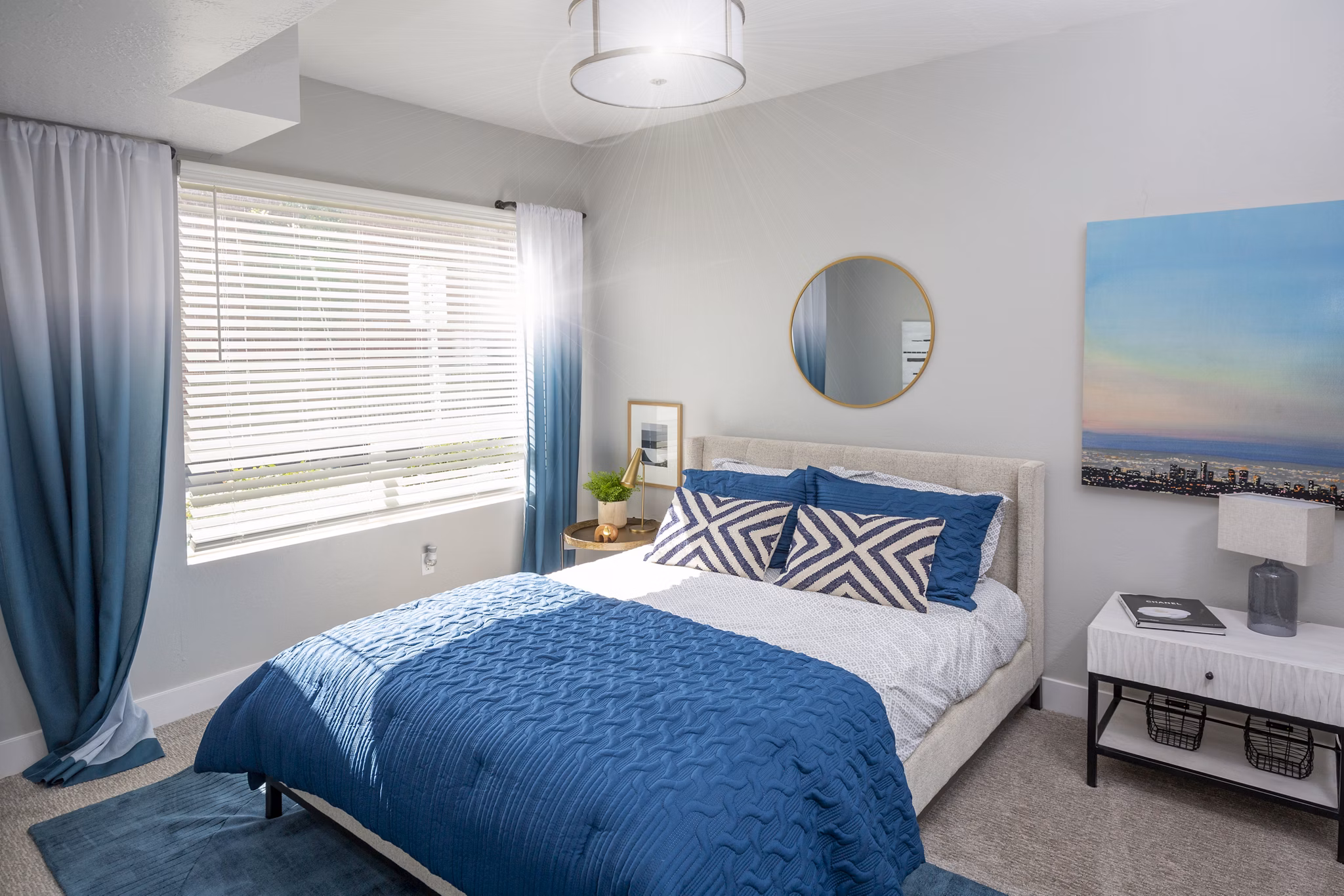 Bedroom featuring modern decor and ample natural light in 644 City Station Apartments, a luxury property offering a stylish retreat in the city