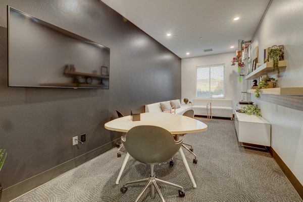 Contemporary clubhouse with sleek design at 644 City Station Apartments, featuring luxurious seating and entertainment areas