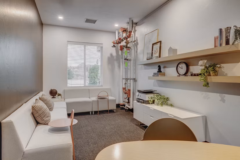 Modern clubhouse with stylish seating and game areas at 644 City Station Apartments