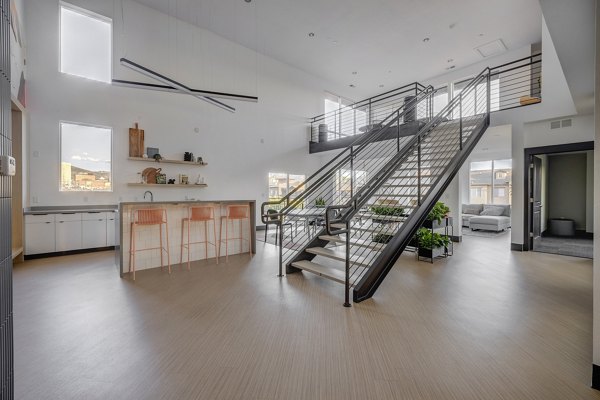 Clubhouse featuring modern design and comfortable seating at 644 City Station Apartments