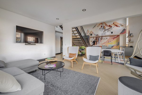 Clubhouse with modern decor and seating at 644 City Station Apartments