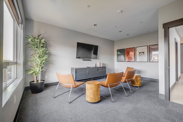 Clubhouse at 644 City Station Apartments featuring modern design and community seating areas Perfect for social gatherings and events