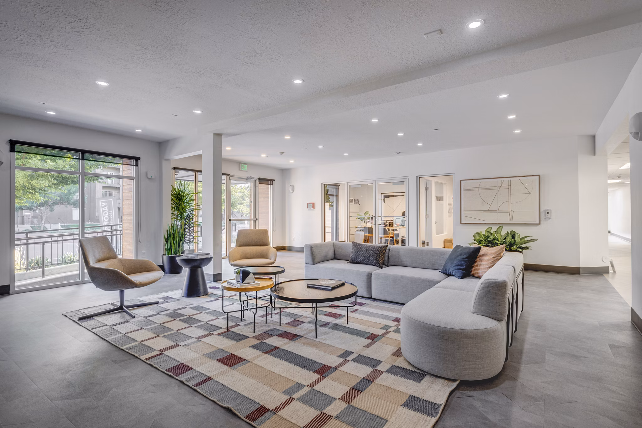Clubhouse featuring modern design and cozy seating at 644 City Station Apartments