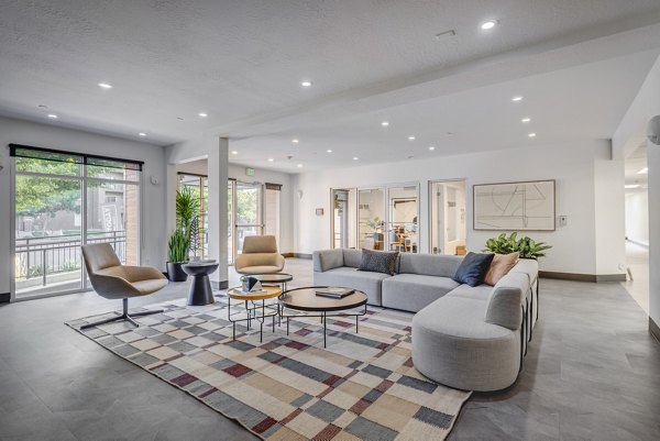 Clubhouse featuring modern design and cozy seating at 644 City Station Apartments