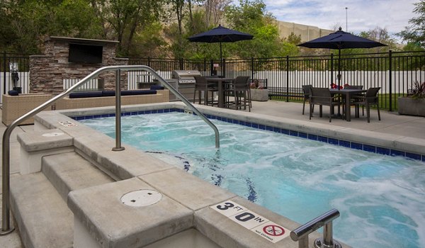 Relaxing hot tub at 644 City Station Apartments offering a luxurious retreat