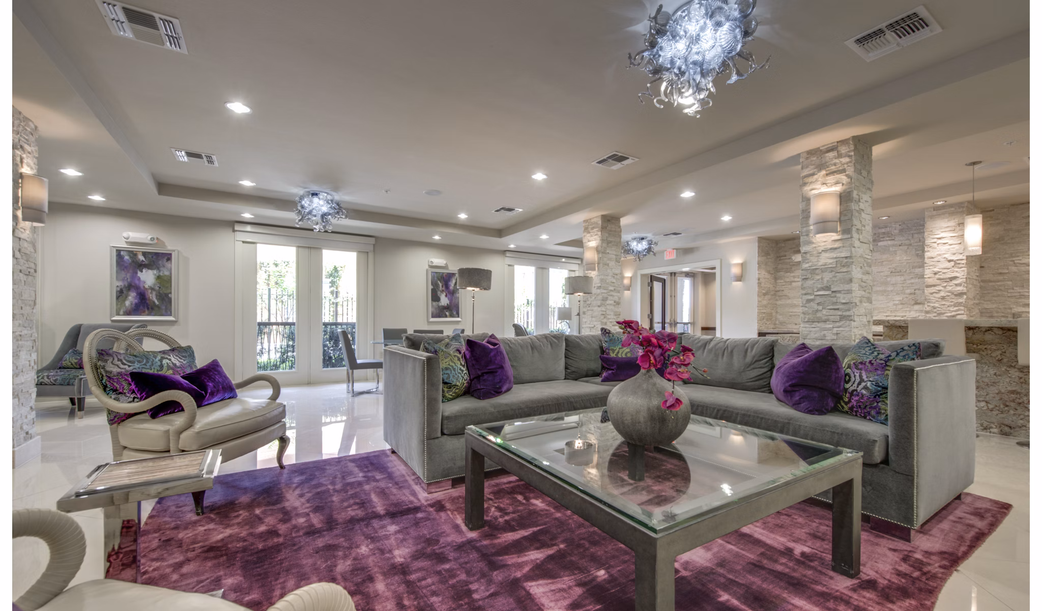 Contemporary clubhouse with modern seating and vibrant decor at 2900 West Dallas Apartments