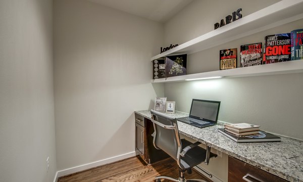 Business center featuring modern workstations at 2900 West Dallas Apartments in Houston