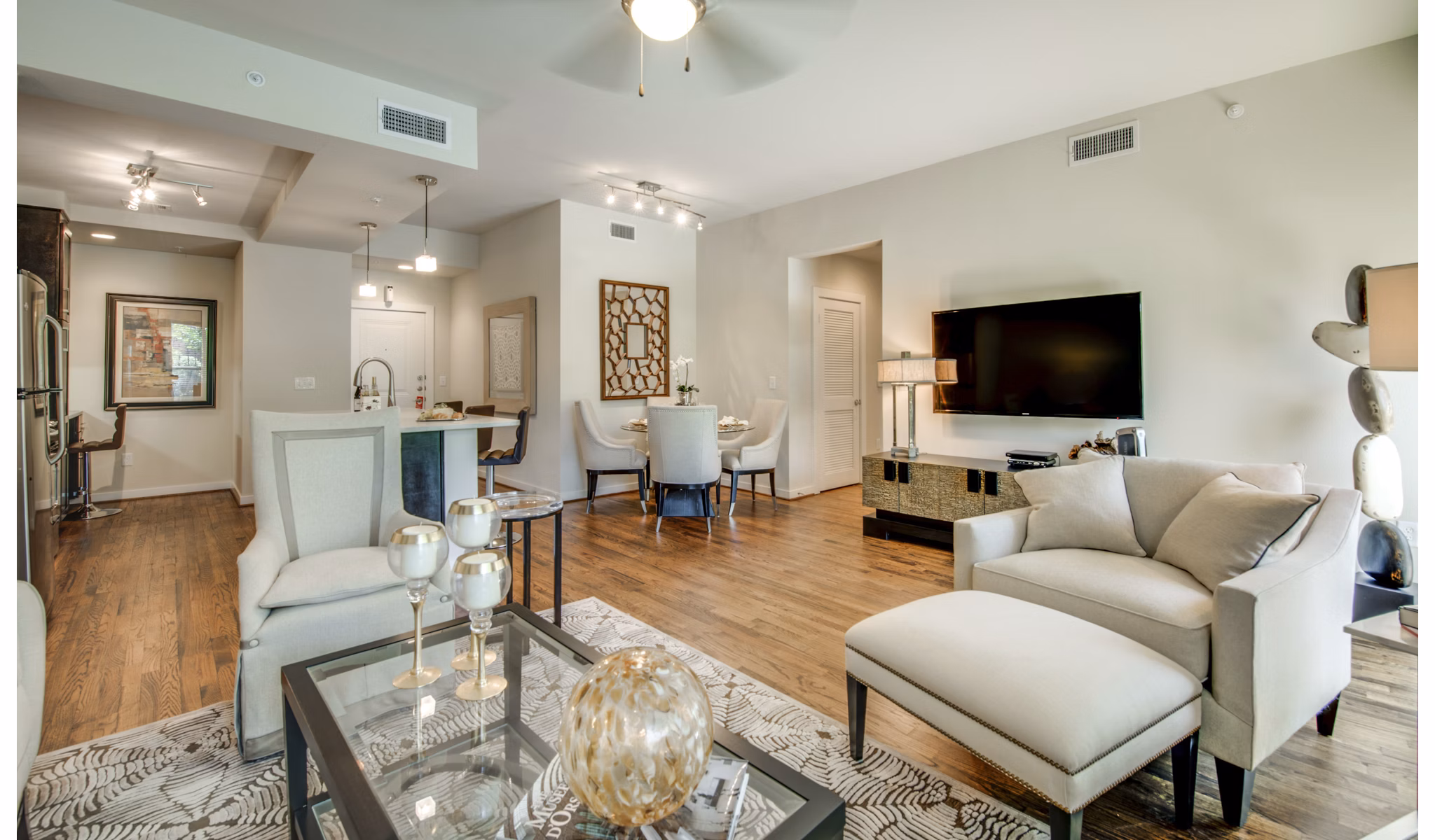 Spacious living room featuring modern decor and large windows at 2900 West Dallas Apartments in Houston
