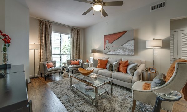 Spacious living room with modern furnishings at 2900 West Dallas Apartments, creating a luxury living experience