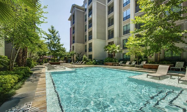 Relaxing pool area with lounge chairs at 2900 West Dallas Apartments, ideal for luxury living and leisure