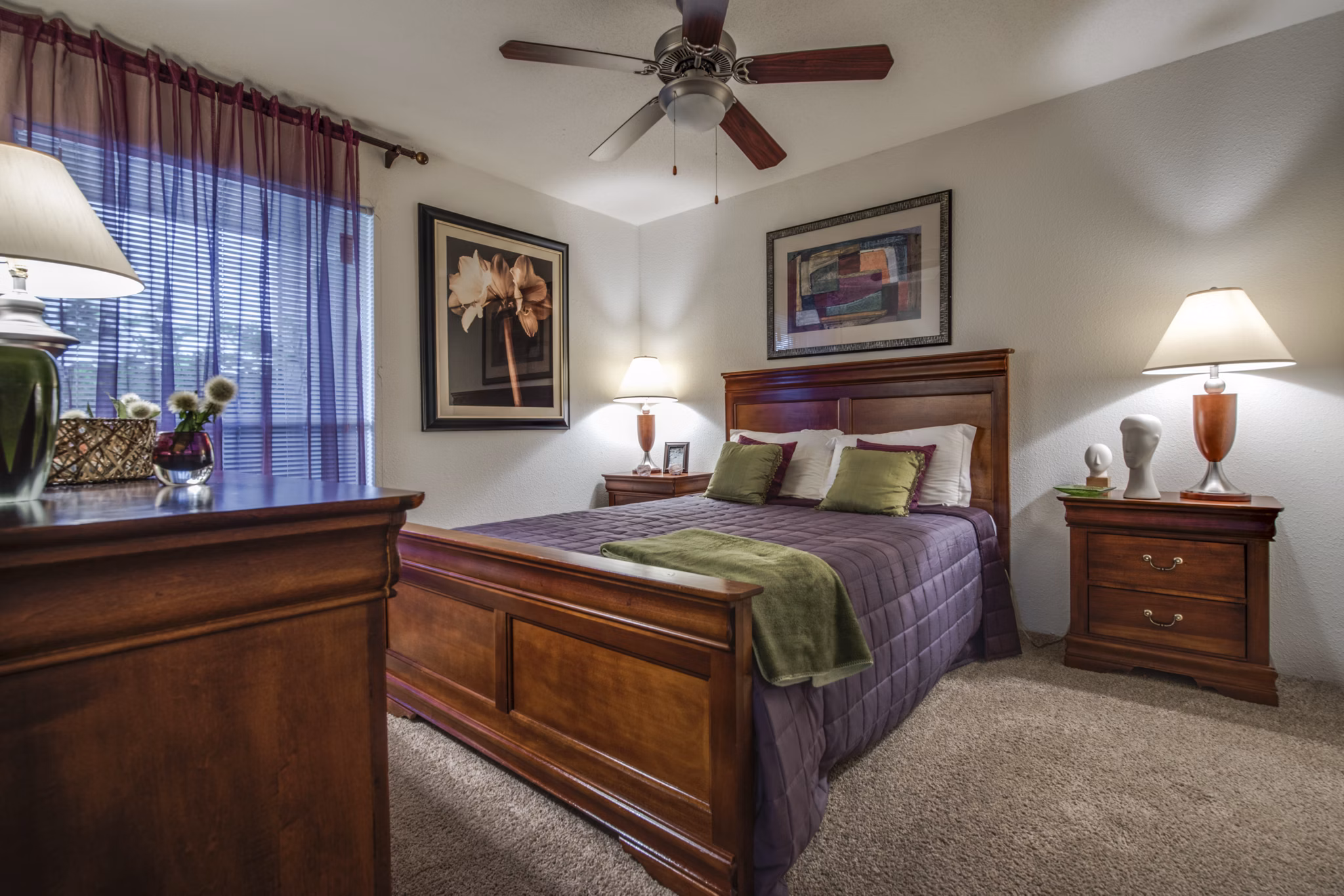 Spacious bedroom with modern decor at The Bellfort Apartments, offering luxury living with elegant design elements and ample natural light