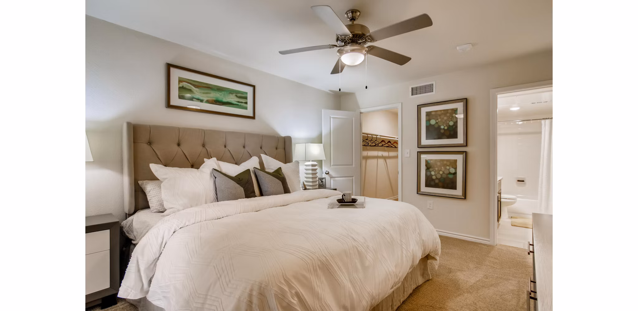 Cozy bedroom with modern decor at The Bellfort Apartments