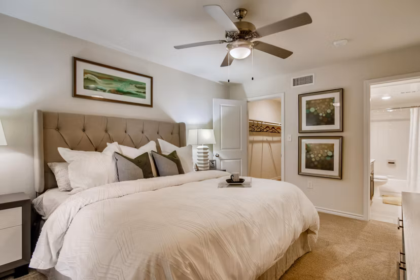 Cozy bedroom with modern decor at The Bellfort Apartments