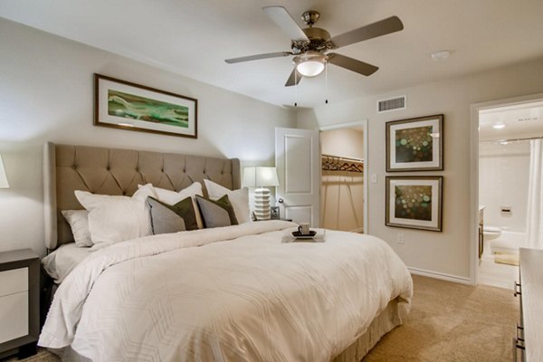Cozy bedroom with modern decor at The Bellfort Apartments