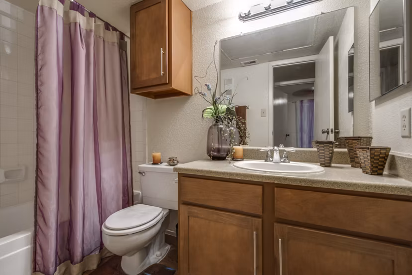 Modern bathroom with sleek fixtures at The Bellfort Apartments featuring luxury design elements and spacious layout
