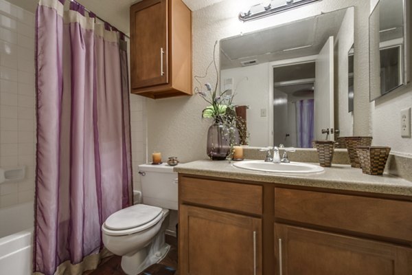 Modern bathroom with sleek fixtures at The Bellfort Apartments featuring luxury design elements and spacious layout