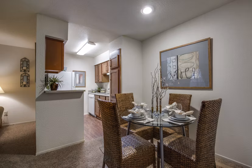 The Bellfort Apartments: Contemporary dining area with sleek furniture and modern lighting