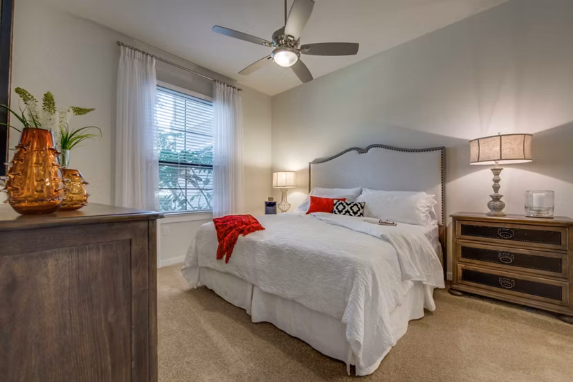 Luxurious bedroom with elegant decor at Grove at Wilcrest Apartments, ideal for a comfortable living experience