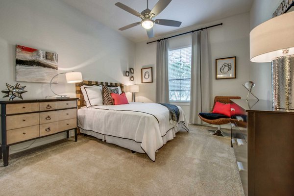 Cozy bedroom with stylish decor at Grove at Wilcrest Apartments