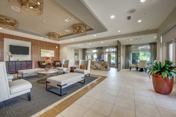 Clubhouse featuring modern design and seating areas at Grove at Wilcrest Apartments