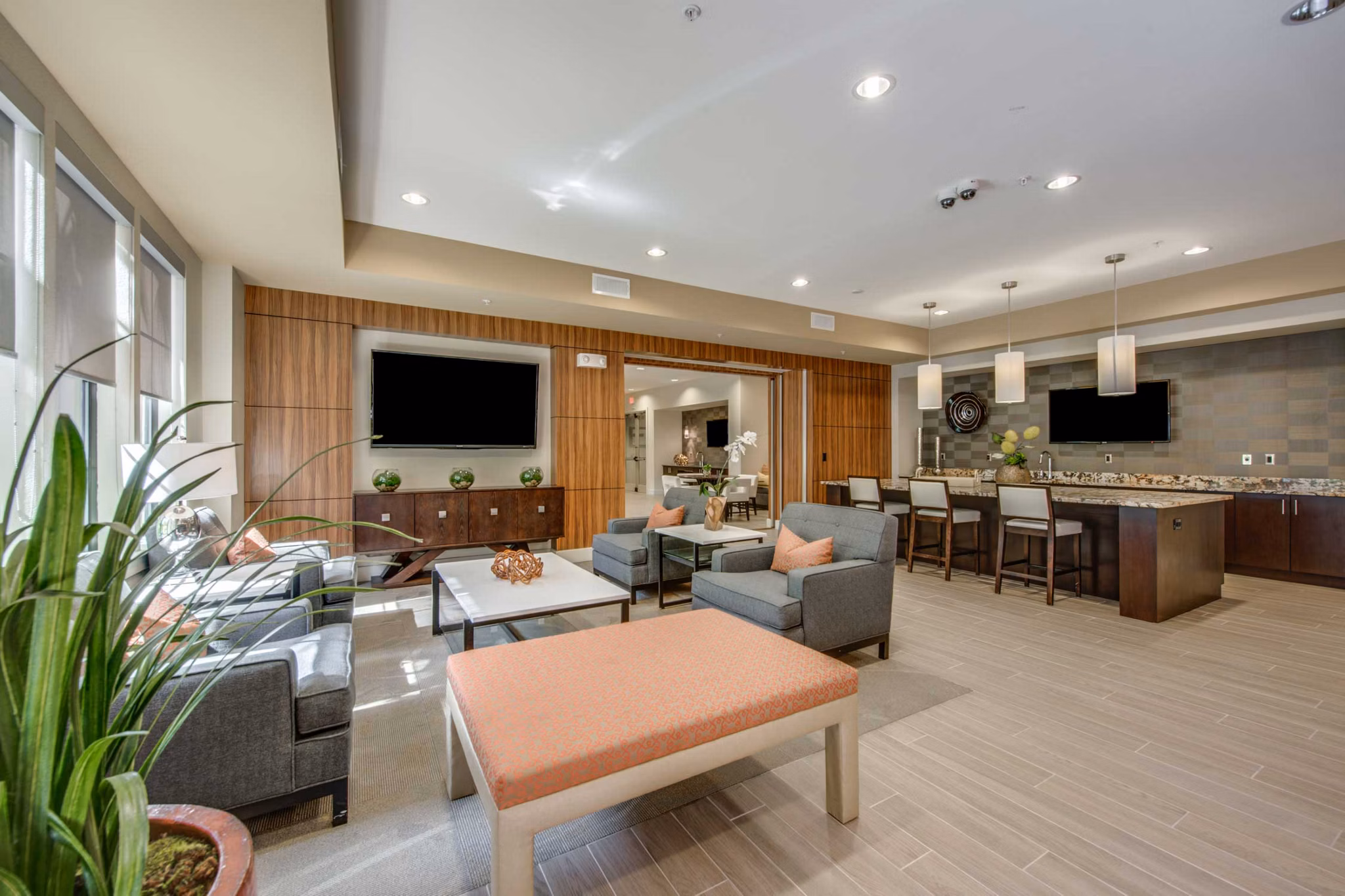 Grove at Wilcrest Apartments: Modern clubhouse featuring luxurious seating and decor
