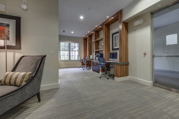 Clubhouse with modern decor and comfortable seating at Grove at Wilcrest Apartments, ideal for resident gatherings and community events