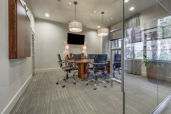 Meeting facility with modern technology at Grove at Wilcrest Apartments, ideal for business gatherings and collaborative workspaces