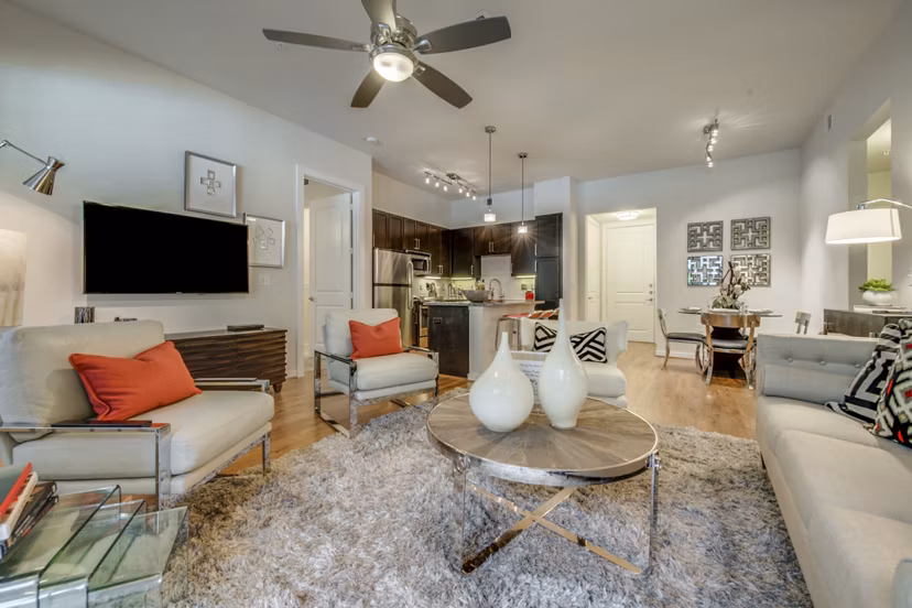 Spacious living room with modern furniture in Grove at Wilcrest Apartments