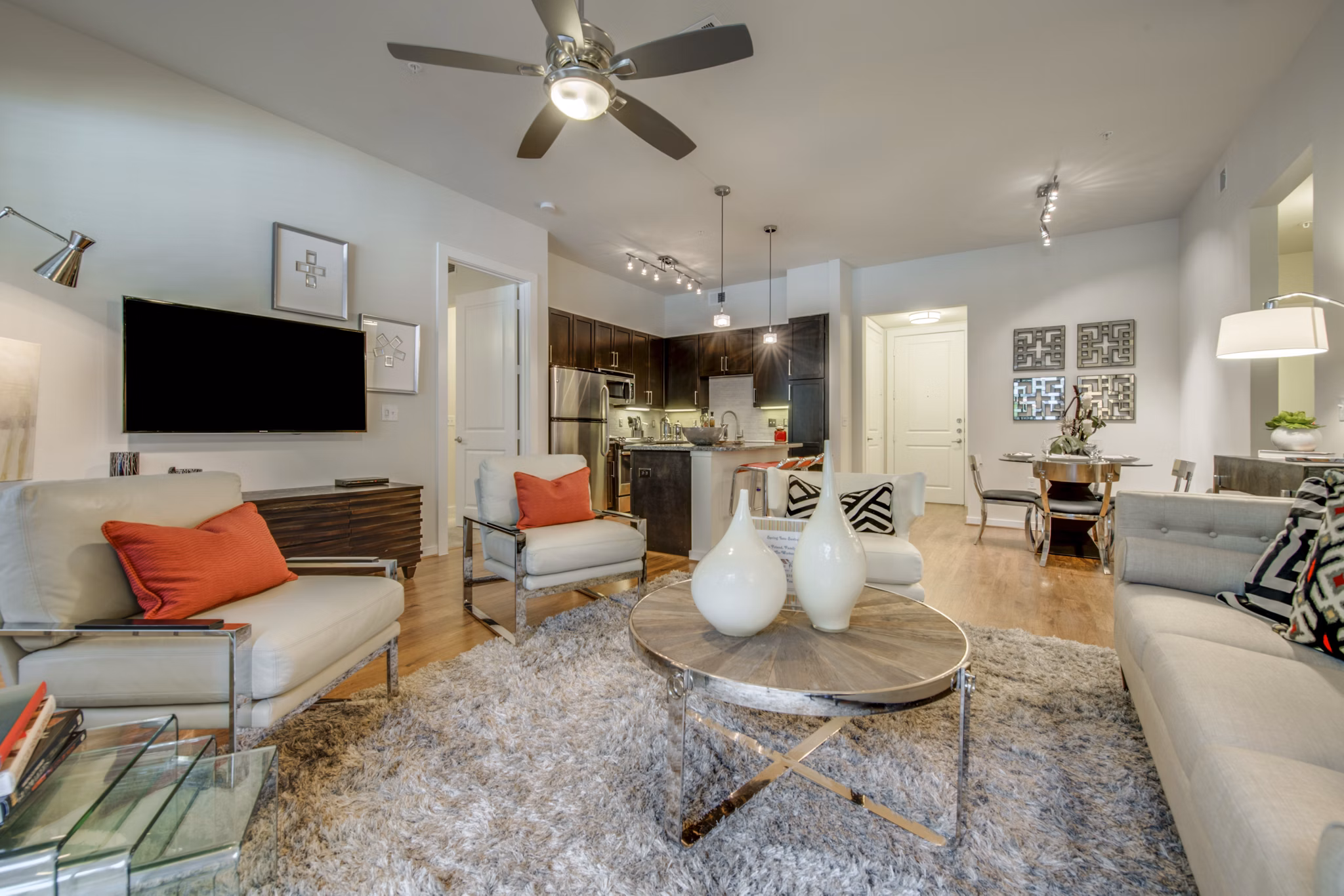 Spacious living room with modern furniture in Grove at Wilcrest Apartments