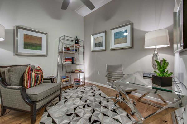 Spacious living room with modern furnishings at Grove at Wilcrest Apartments