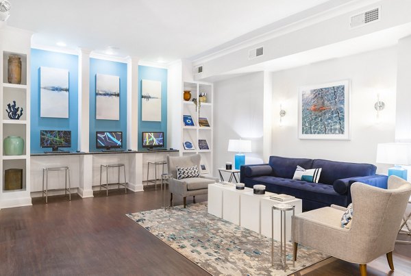 Clubhouse featuring modern lounge seating and designer lighting at Jackson Hill Apartments