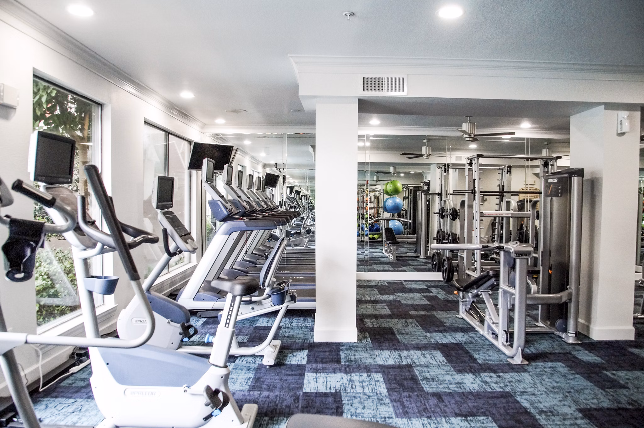 State-of-the-art fitness center with modern equipment at Jackson Hill Apartments
