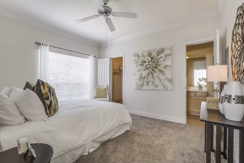 Cozy bedroom with modern furnishings at Las Palmas Apartments
