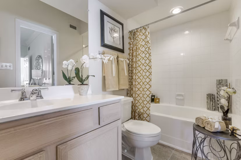 Elegant bathroom with marble countertops and modern fixtures at Las Palmas Apartments