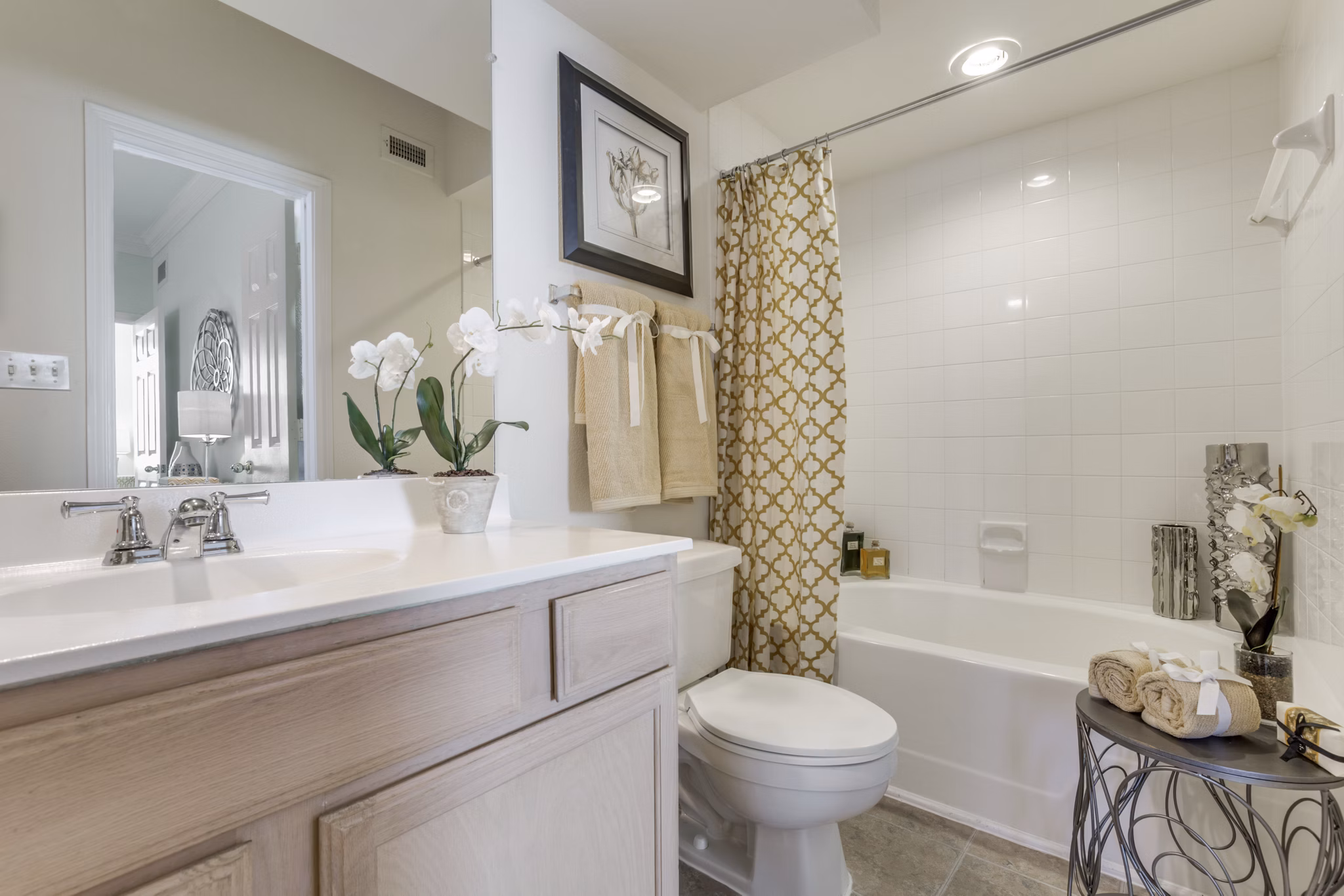 Elegant bathroom with marble countertops and modern fixtures at Las Palmas Apartments