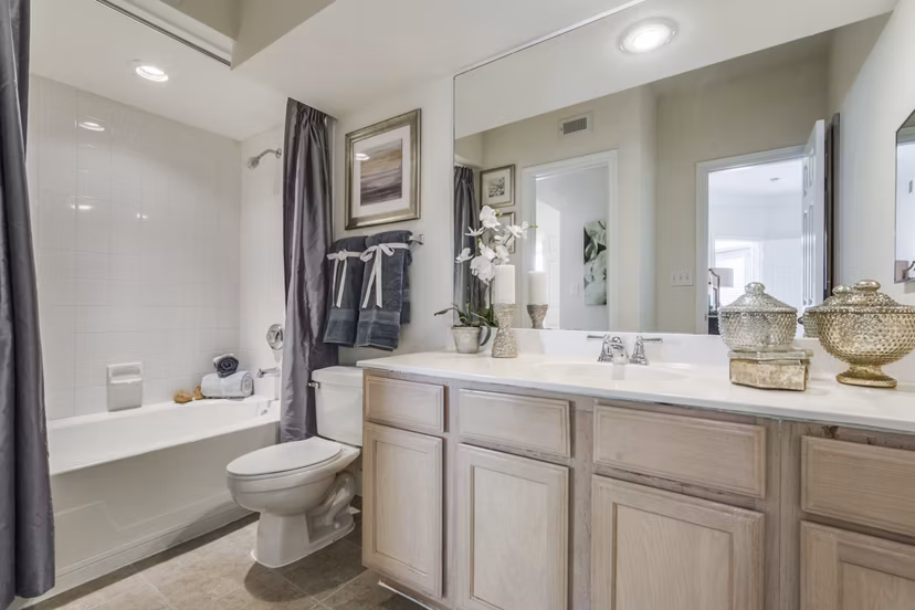 Modern bathroom with sleek fixtures at Las Palmas Apartments featuring luxury finishes and elegant design
