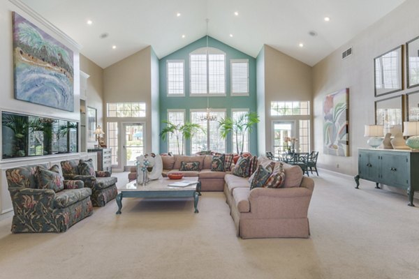 Elegant clubhouse with modern furnishings at Las Palmas Apartments, offering luxury community spaces for residents