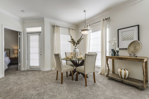 Dining area featuring elegant design and modern furnishings at Las Palmas Apartments