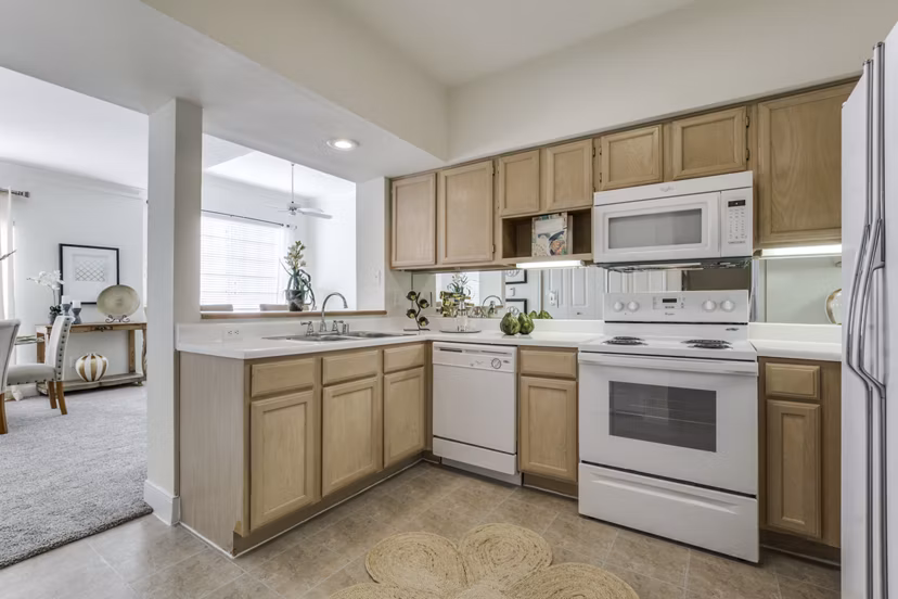 Sleek kitchen with modern appliances in Las Palmas Apartments luxury rental living spaces