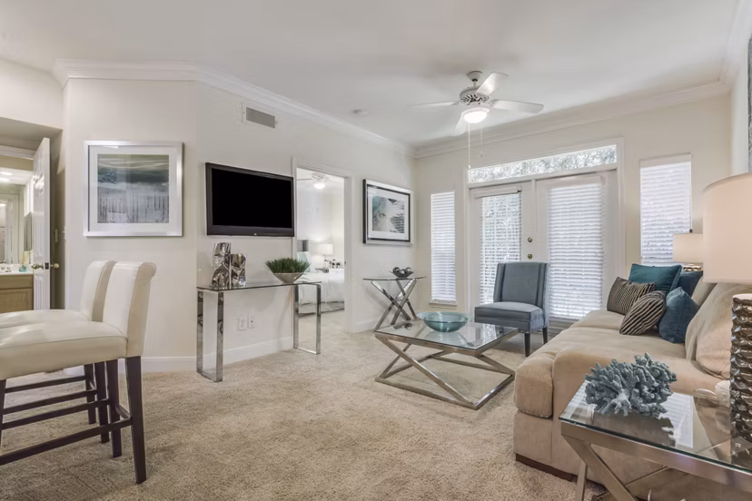 Modern living room with sleek furniture at Las Palmas Apartments
