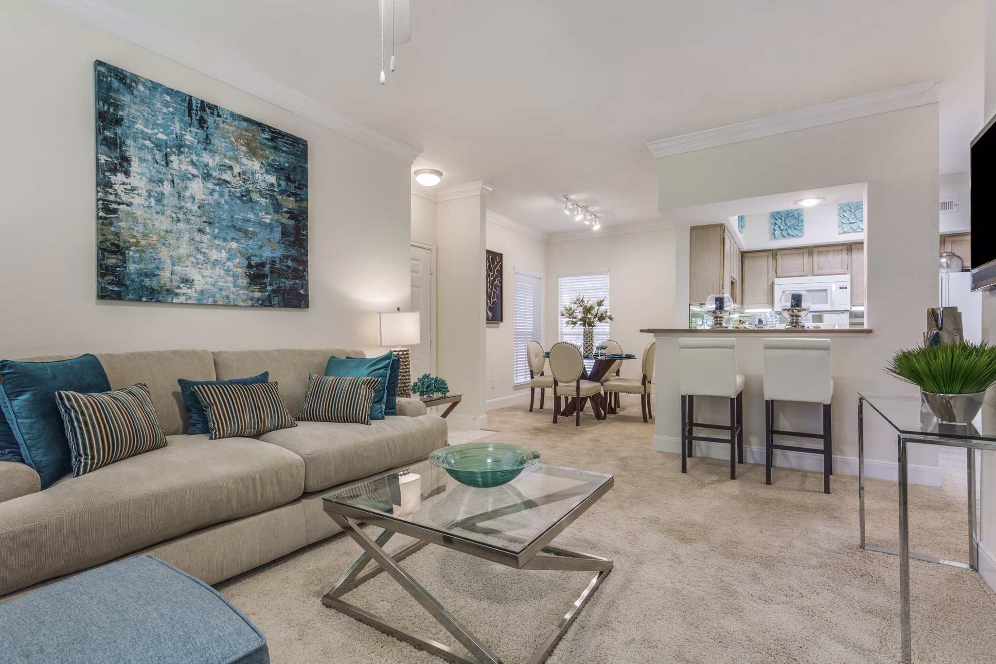 Living room with contemporary decor and natural light at Las Palmas Apartments