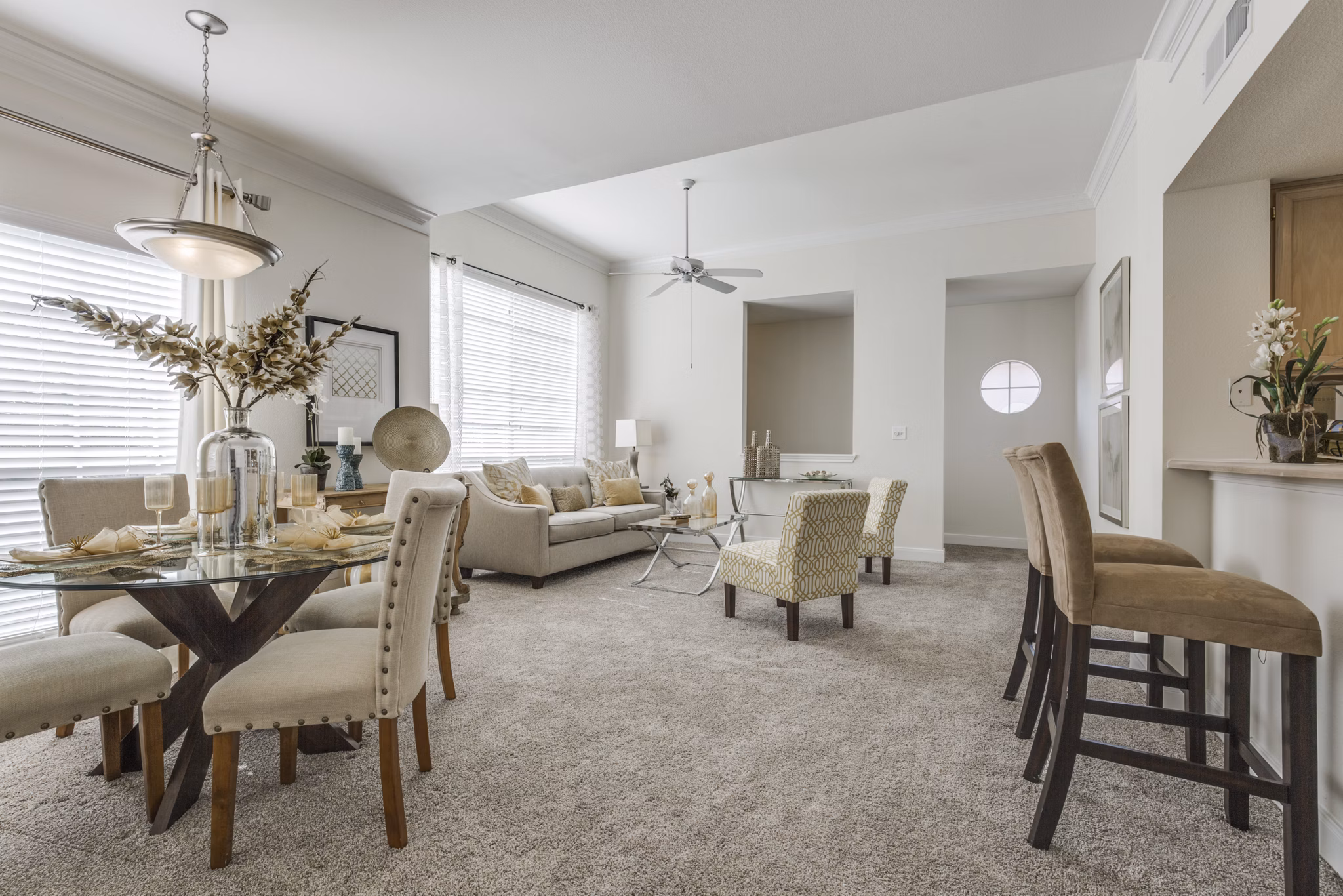 Spacious living room with modern dÃ©cor and large windows in Las Palmas Apartments