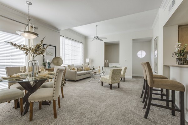 Spacious living room with modern dÃ©cor and large windows in Las Palmas Apartments