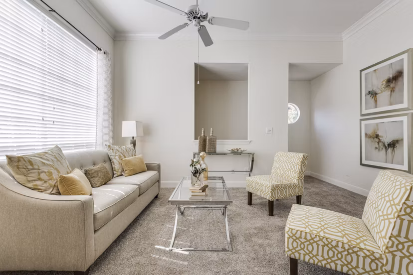 Spacious living room with contemporary furnishings at Las Palmas Apartments