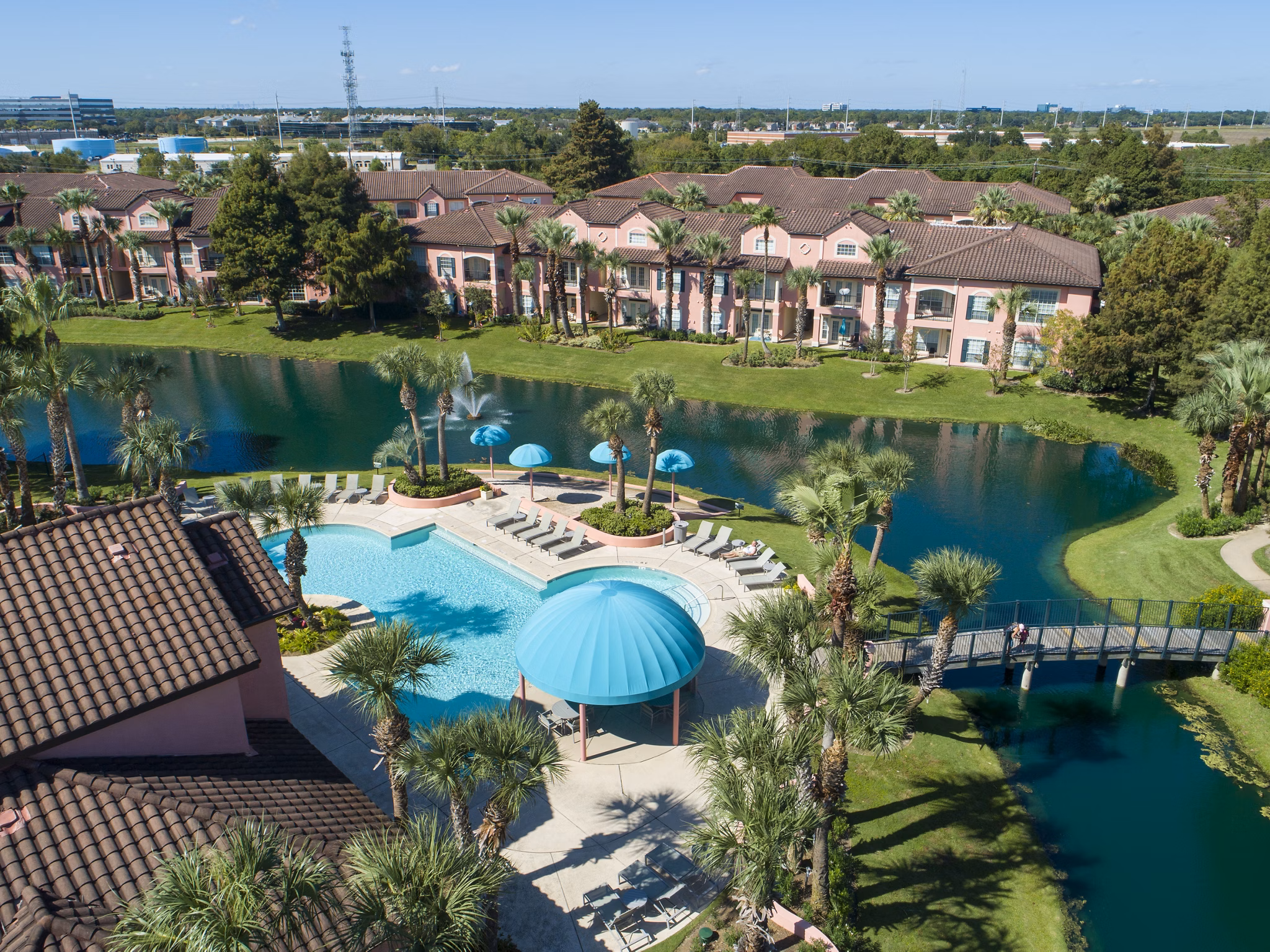 Sparkling outdoor pool at Las Palmas Apartments offering relaxation and luxury for residents