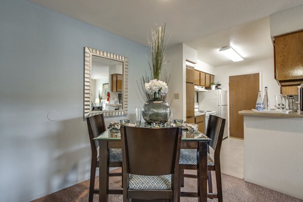 Dining area featuring modern furniture and stylish lighting at Sabo Village Apartments