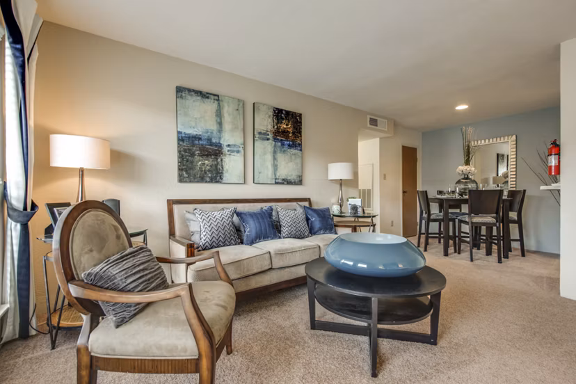 Spacious living room with modern furnishings at Sabo Village Apartments