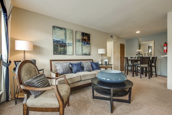 Spacious living room with modern furnishings at Sabo Village Apartments