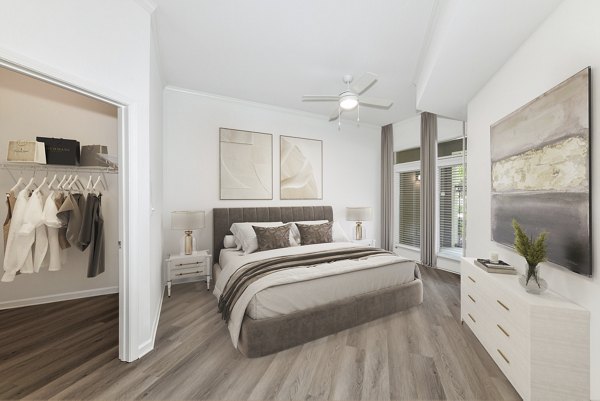 Stylish bedroom with modern furnishings at Kingsboro Luxury Apartments